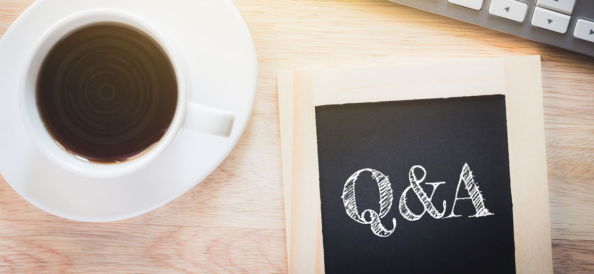 Concept Q&A message on wood boards. A keyboard and a glass coffe