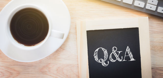 Concept Q&A message on wood boards. A keyboard and a glass coffe