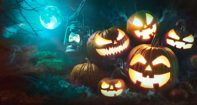 Halloween pumpkin head jack lantern with burning candles