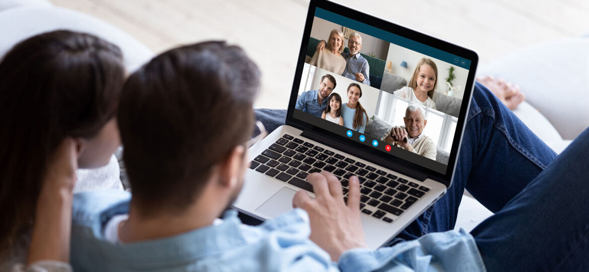 Couple chatting with relatives via videoconference video call application