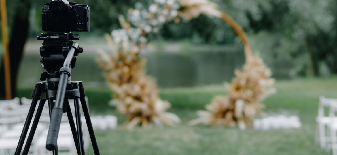 the camera stands on a tripod and shoots the wedding ceremony