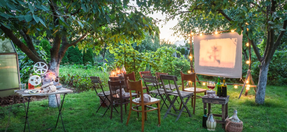 Summer cinema with retro projector in the evening