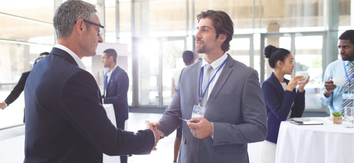 Business people shaking hand during a seminar