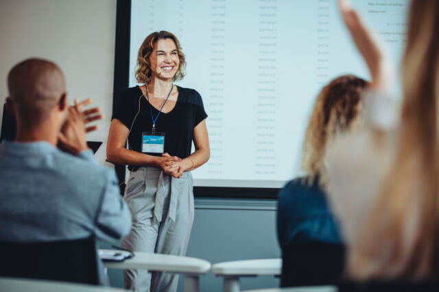 Presenter getting applause after a great presentation