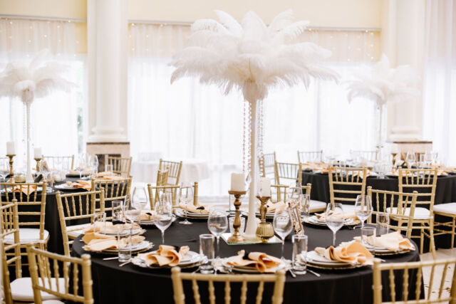 The restaurant hall with luxurious round tables decorated with bright and stylish decor is ready for reception.