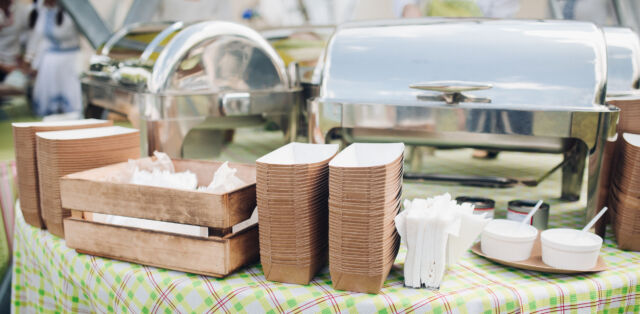 A table with served food and containers.