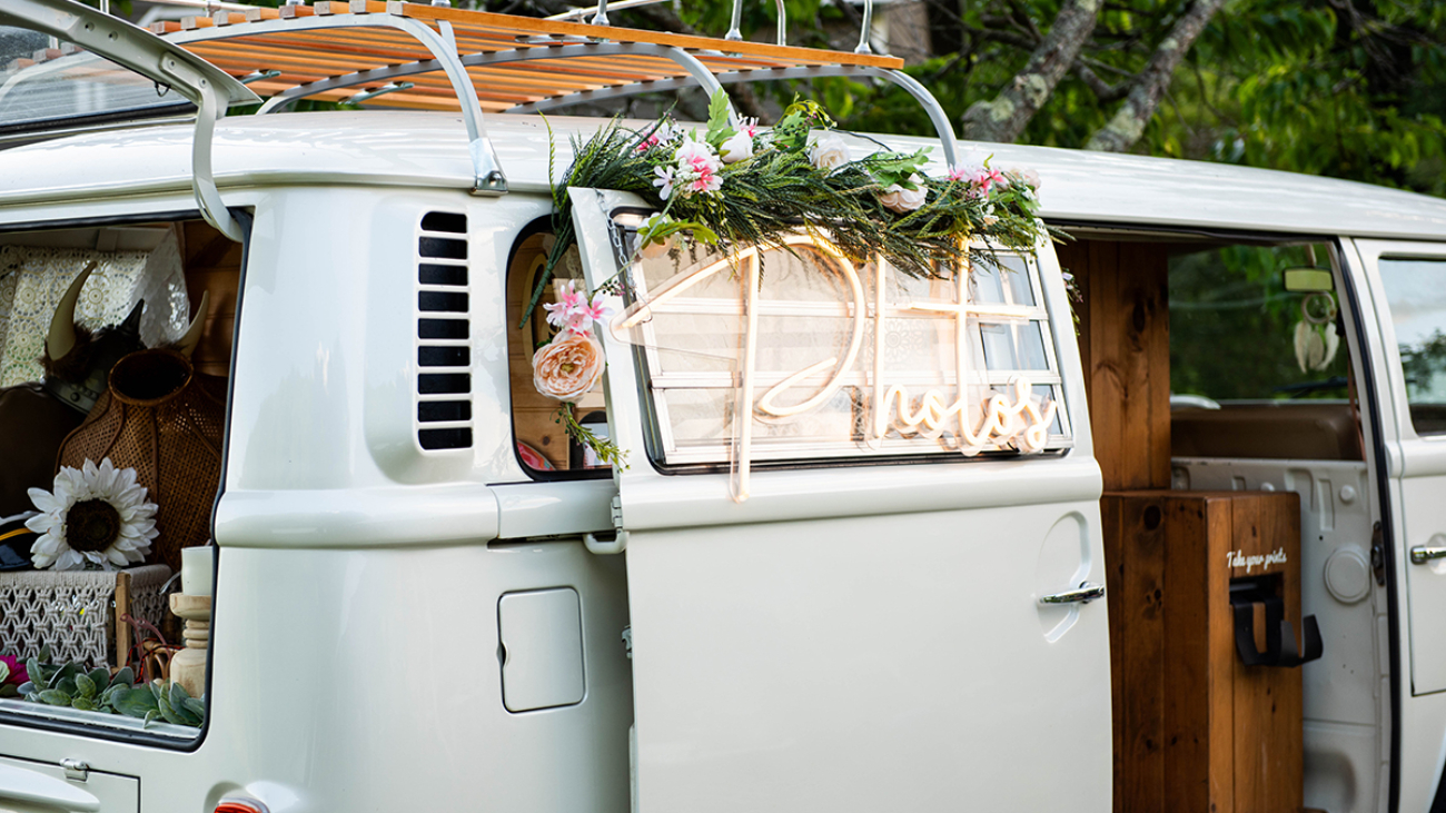 Minibus van converted to photo booth at summer wedding reception